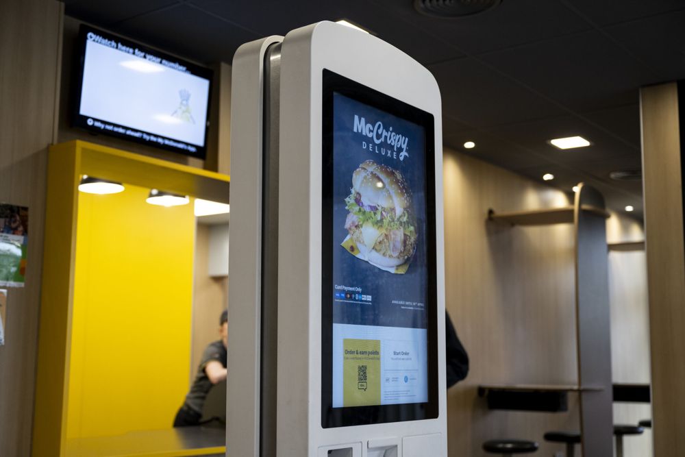 Close-up of an MGtal self-order kiosk showing the menu screen